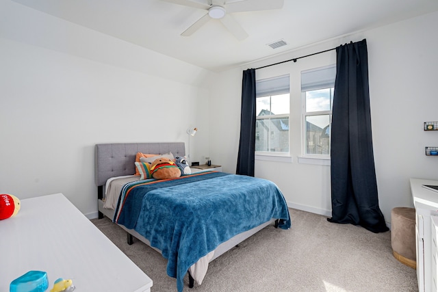 carpeted bedroom with lofted ceiling and ceiling fan