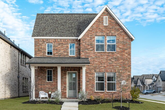 back of property with a patio and a yard