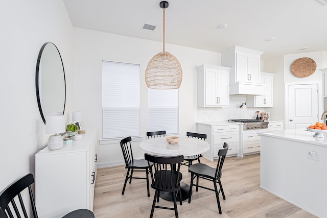 dining room featuring light wood-type flooring