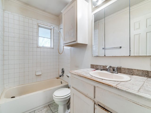 full bathroom with toilet, tile patterned flooring, crown molding, tiled shower / bath, and vanity