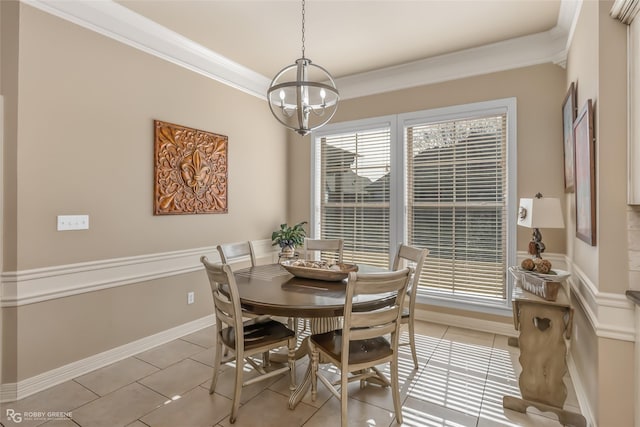 dining space featuring an inviting chandelier, crown molding, and light tile patterned floors