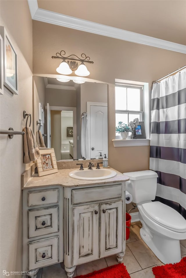 bathroom featuring ornamental molding, vanity, tile patterned floors, and toilet