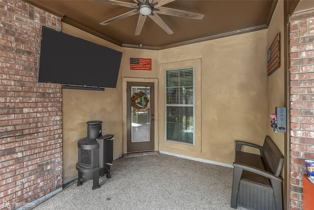 exterior space with ceiling fan