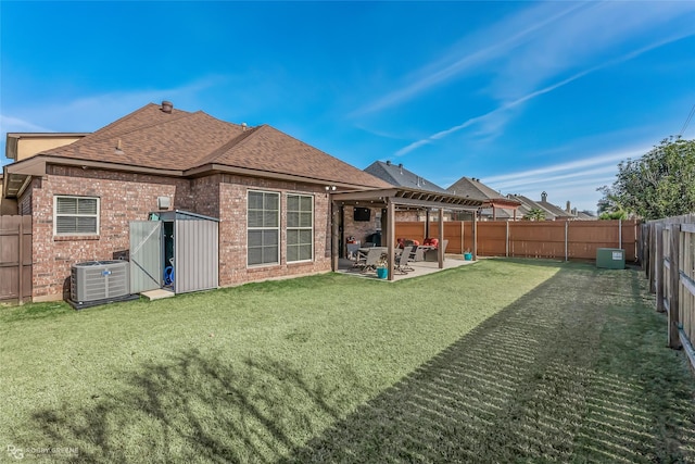 back of house featuring central air condition unit, a yard, and a patio