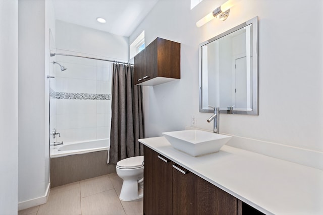 full bathroom with shower / bath combination with curtain, tile patterned floors, vanity, and toilet