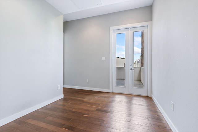 spare room featuring dark hardwood / wood-style floors