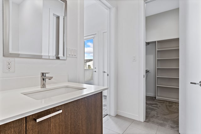 bathroom with vanity and tile patterned flooring