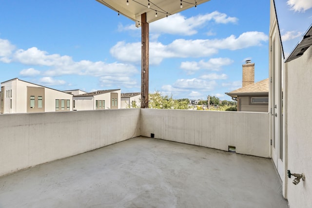 view of patio featuring a balcony