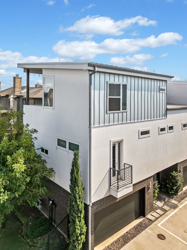 view of side of home with a garage