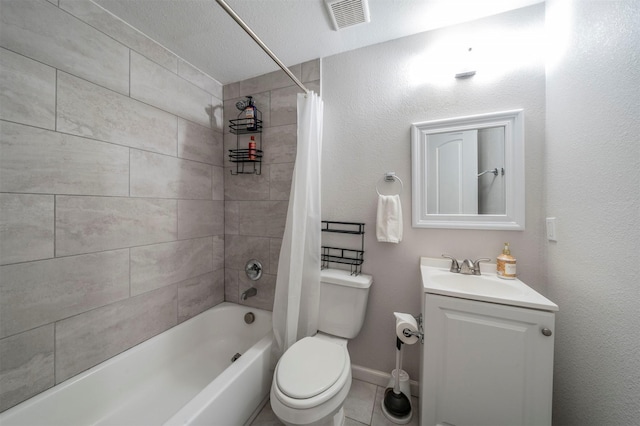 full bathroom featuring toilet, a textured ceiling, shower / bath combo with shower curtain, tile patterned floors, and vanity