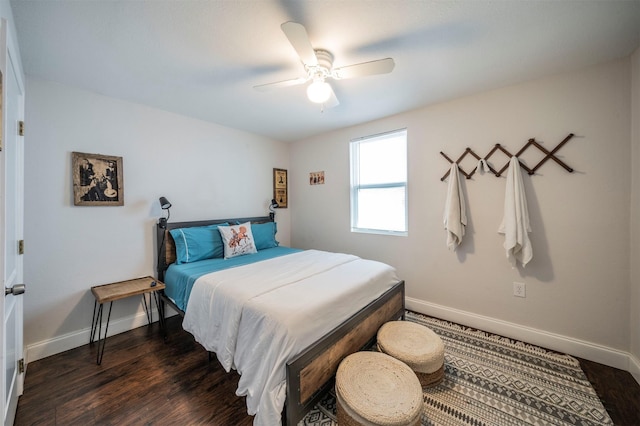 bedroom featuring dark hardwood / wood-style flooring and ceiling fan