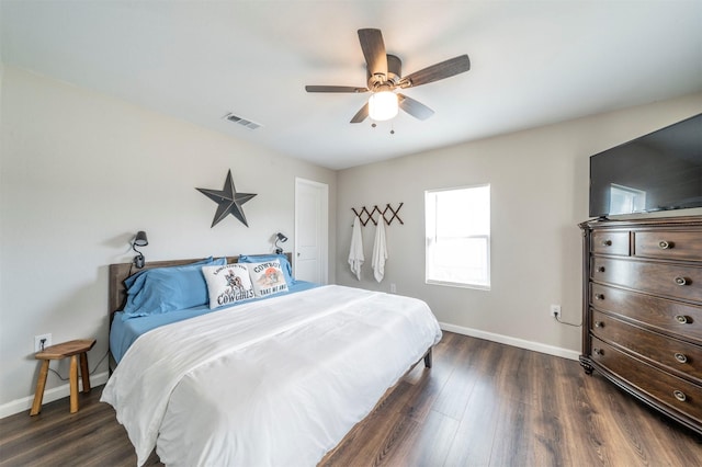 bedroom featuring dark hardwood / wood-style flooring and ceiling fan