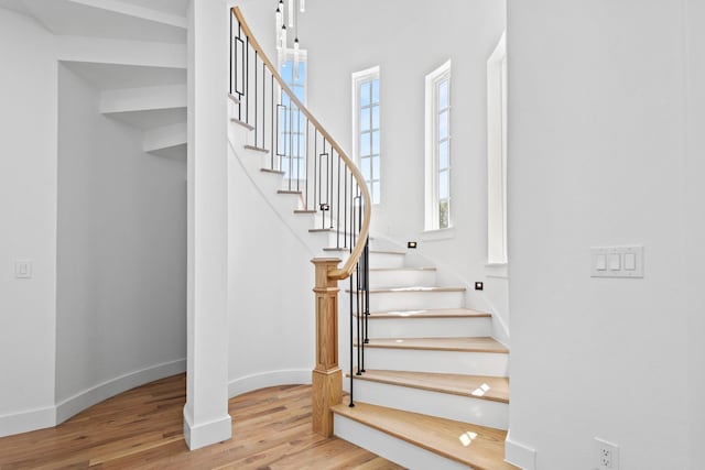 stairs with wood-type flooring