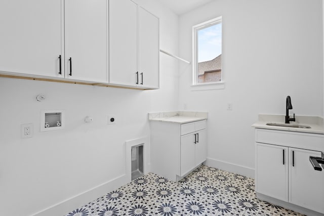 laundry room featuring sink, washer hookup, cabinets, hookup for an electric dryer, and hookup for a gas dryer