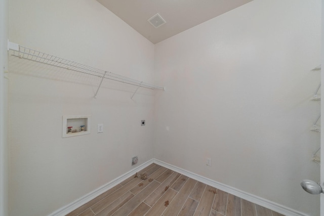 clothes washing area with hookup for a washing machine and electric dryer hookup