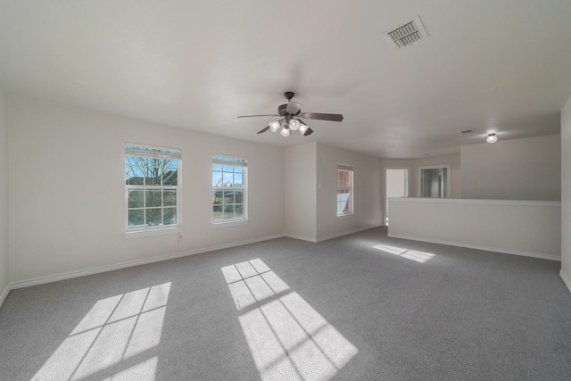 carpeted empty room featuring ceiling fan