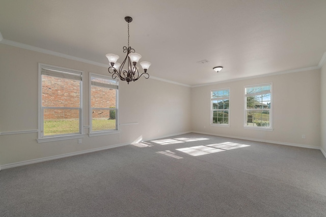 spare room featuring carpet flooring, a chandelier, and ornamental molding