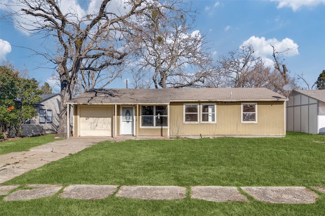 ranch-style house featuring a front lawn and a garage