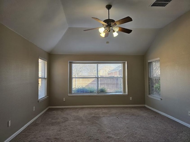 carpeted empty room featuring ceiling fan and lofted ceiling