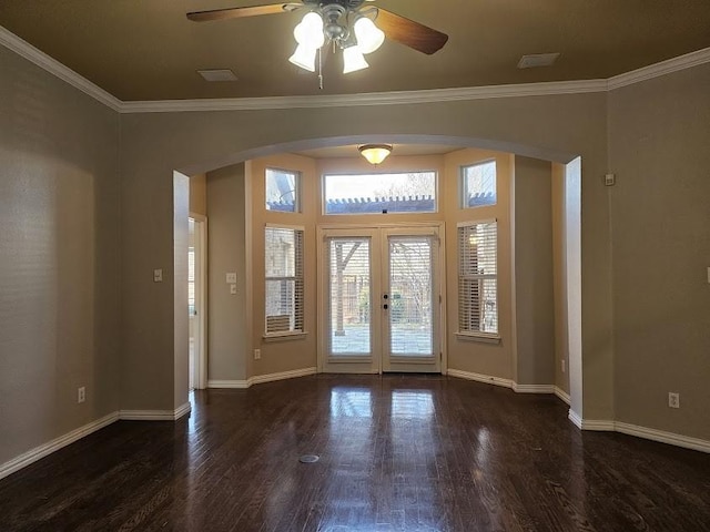 foyer entrance featuring dark wood-type flooring, ceiling fan, french doors, and crown molding