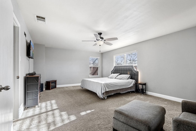 carpeted bedroom featuring ceiling fan