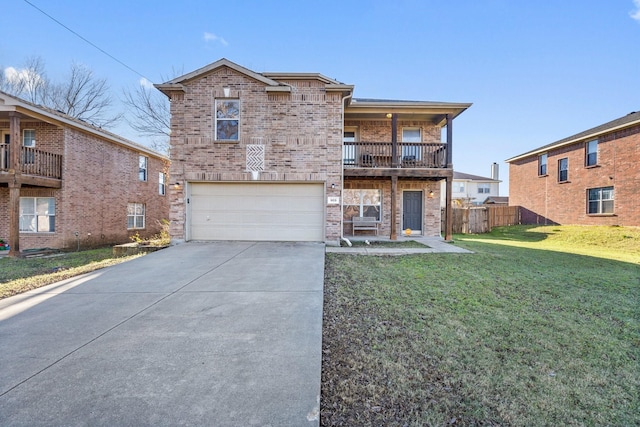 front facade featuring a front yard, a balcony, and a garage