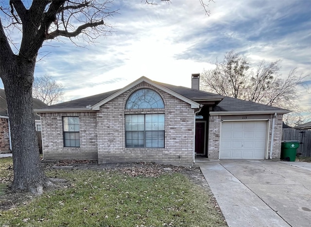 single story home featuring a garage