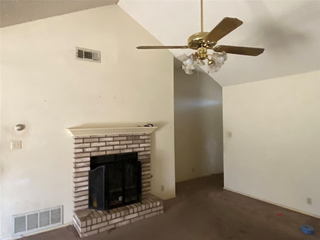 unfurnished living room featuring ceiling fan, a brick fireplace, and lofted ceiling