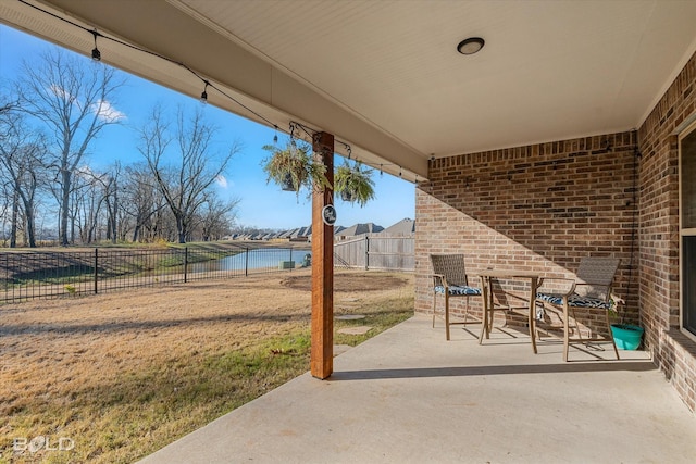 view of patio featuring a water view