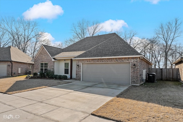 view of front of property featuring a front lawn and a garage