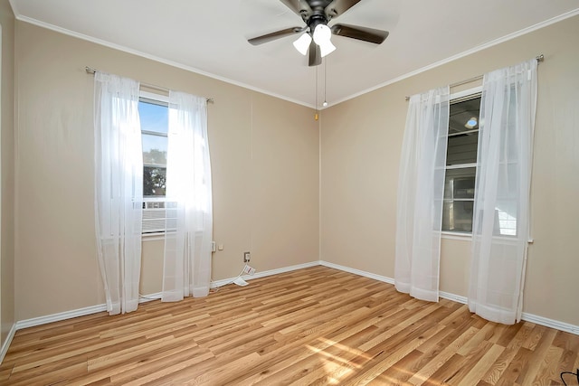 spare room featuring light hardwood / wood-style floors, ceiling fan, ornamental molding, and cooling unit