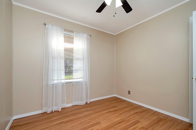 spare room featuring light hardwood / wood-style floors, ceiling fan, and crown molding