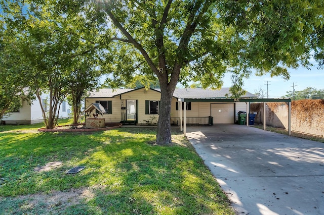 ranch-style house featuring a front yard and a garage