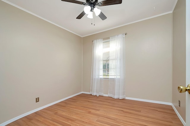 spare room with ceiling fan, light wood-type flooring, and ornamental molding