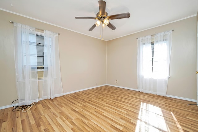 empty room with ceiling fan, light hardwood / wood-style flooring, and crown molding