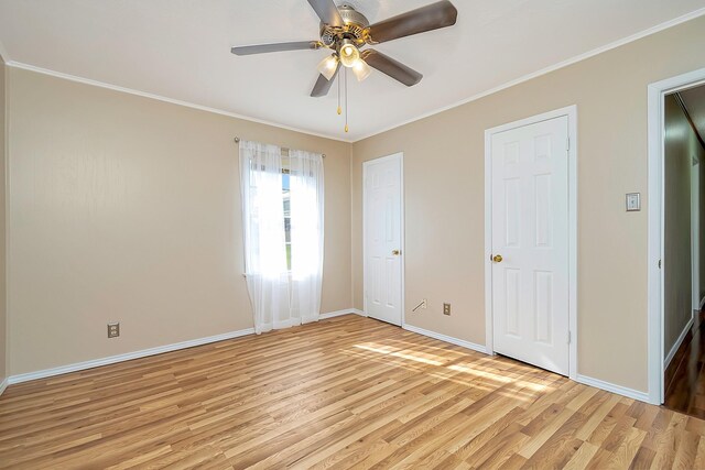 unfurnished bedroom with ornamental molding, ceiling fan, and light hardwood / wood-style flooring