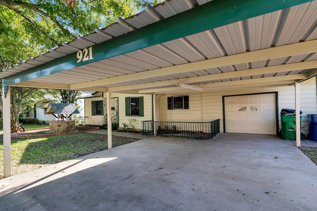 view of front of property with a garage and a carport