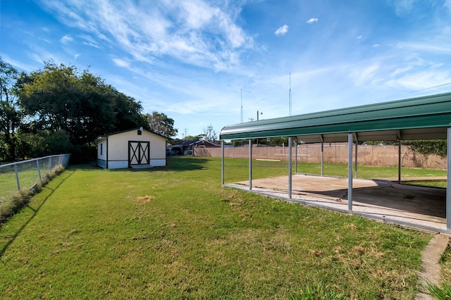 view of yard featuring a carport and a shed