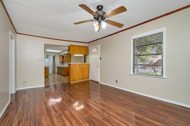 unfurnished living room featuring ornamental molding, a textured ceiling, ceiling fan, and dark hardwood / wood-style floors