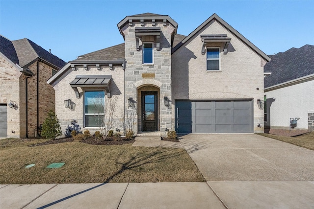 view of front of home with a front yard and a garage