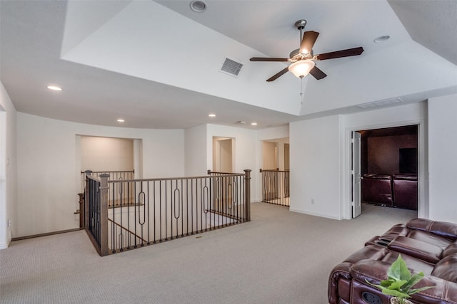 interior space with light carpet and vaulted ceiling