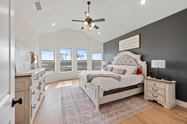 bedroom with lofted ceiling, ceiling fan, and light hardwood / wood-style floors