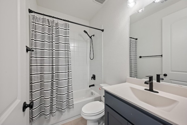 full bathroom with shower / bathtub combination with curtain, tile patterned floors, vanity, and toilet