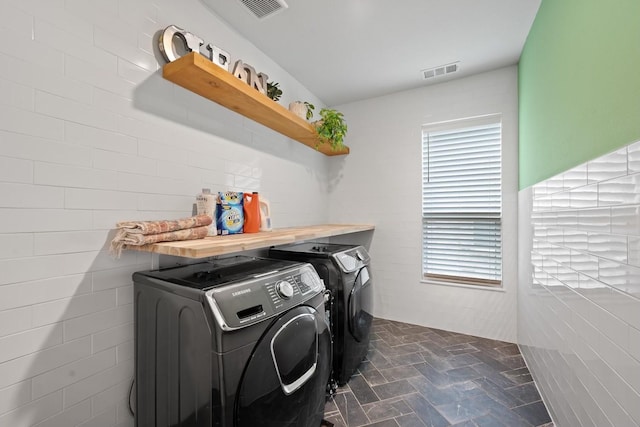 laundry area featuring separate washer and dryer