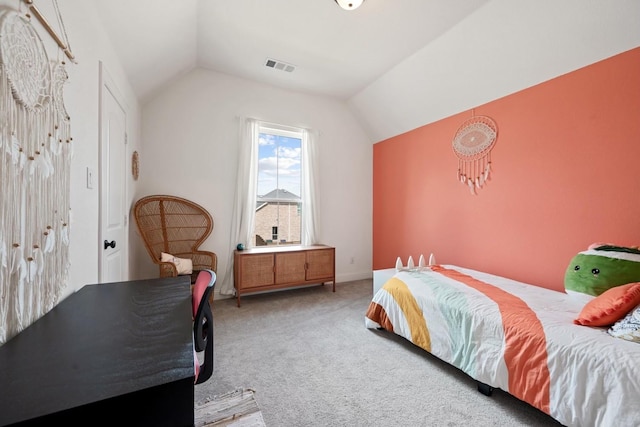 carpeted bedroom with lofted ceiling