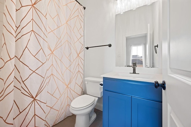 bathroom with toilet and vanity