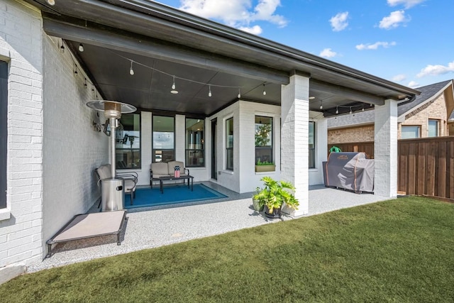 rear view of house with a patio area and a lawn