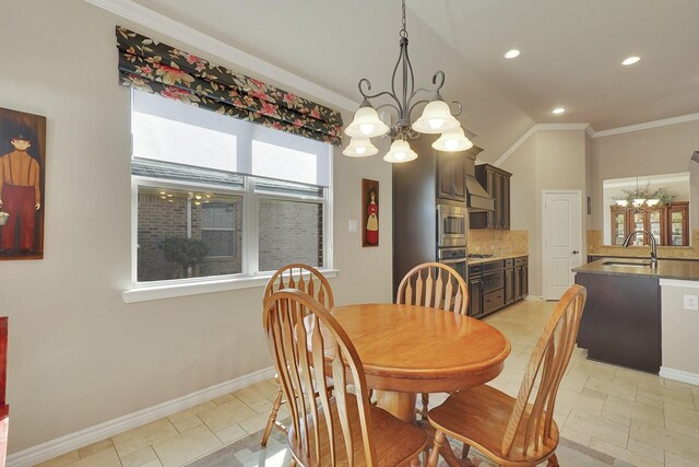 dining room with an inviting chandelier, baseboards, crown molding, and recessed lighting