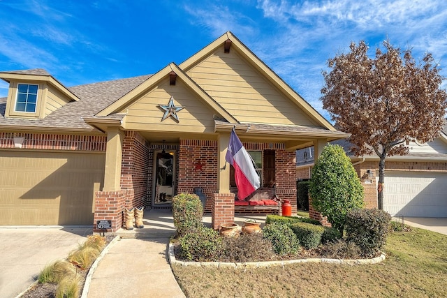 view of front of house featuring covered porch and a garage