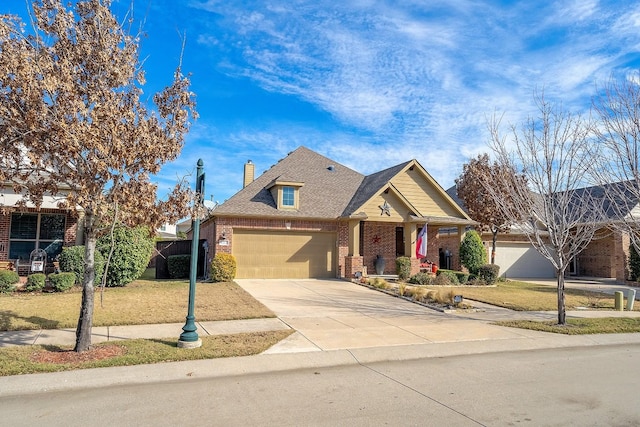 craftsman inspired home with an attached garage, brick siding, concrete driveway, a front lawn, and a chimney